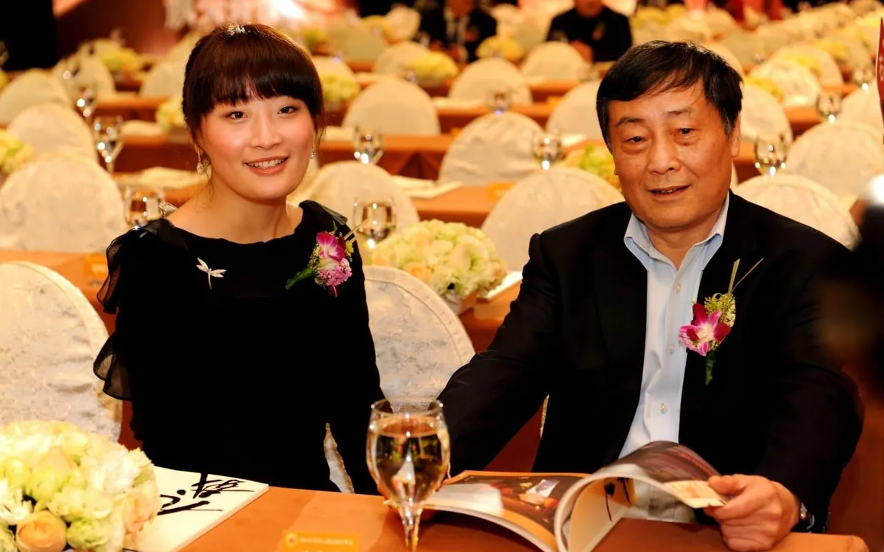 Kelly Zong with her father Zong Qinghou, founder of Wahaha Group, at a formal event